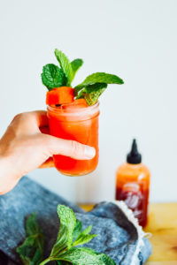 A tasty summer cocktail with a bit of a punch - the Sriracha Watermelon Cooler from By Gabriella / bygabriella.co