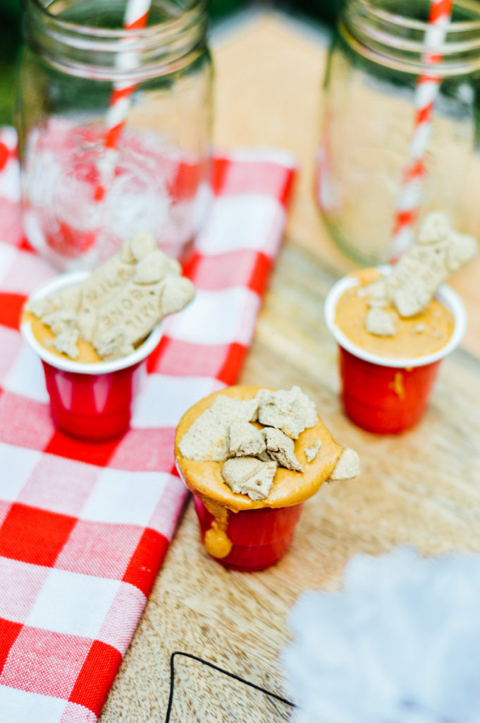 Peanut butter shots with crushed biscuits for a fun puppy party! / bygabriella.co