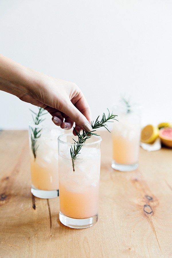 Pretty in Pink cocktail recipe by Waiting on Martha with St-Germain, rosemary, and grapefruit / bygabriella.co