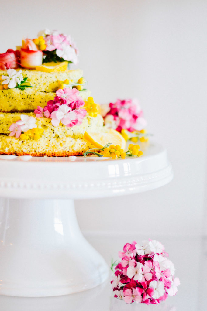 A Floral Lemon Poppyseed Cake with rhubarb ribbons and fresh edible flowers | bygabriella.co