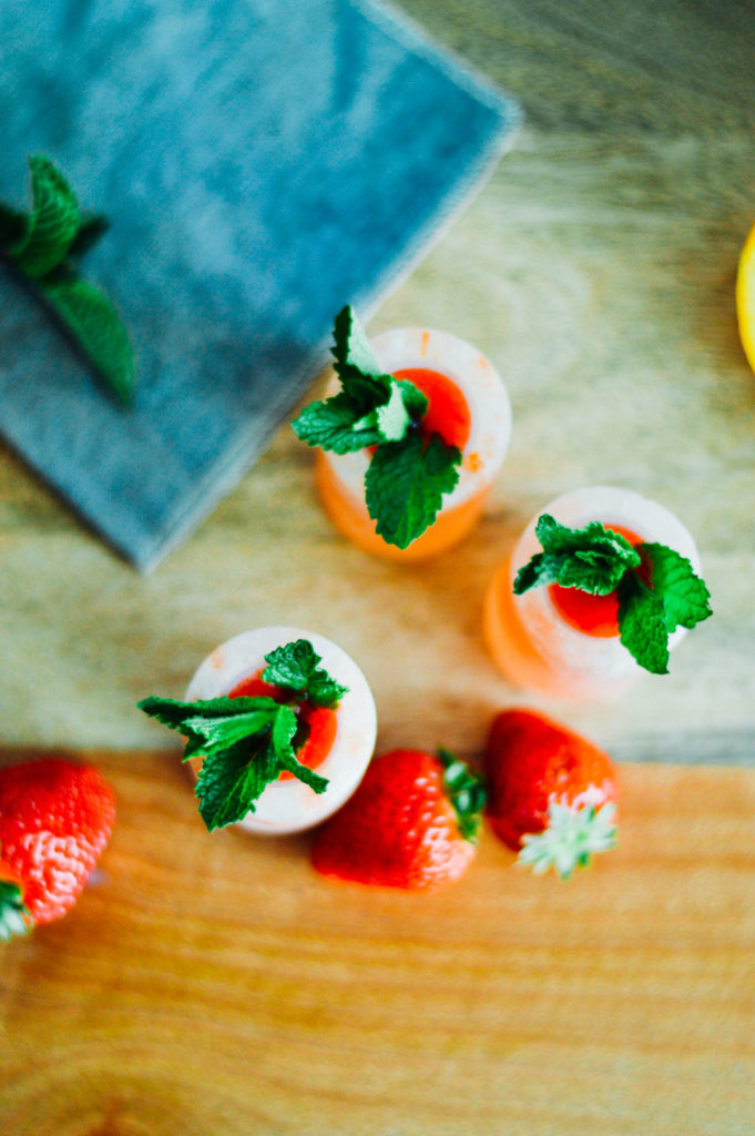 A strawberry filled, mint mezcal shot. Try making these for a mini brunch party! | bygabriella.co