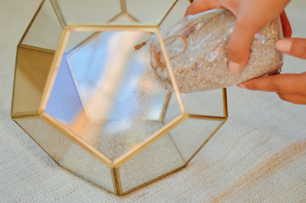 DIY Decorative Terrarium project tip: Start with some light sand as your base | bygabriella.co
