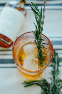 An Elderflower Whisky Cordial (easy!) cocktail recipe. Make your own with only 4 ingredients - and fresh rosemary for garnish! | bygabriella.co