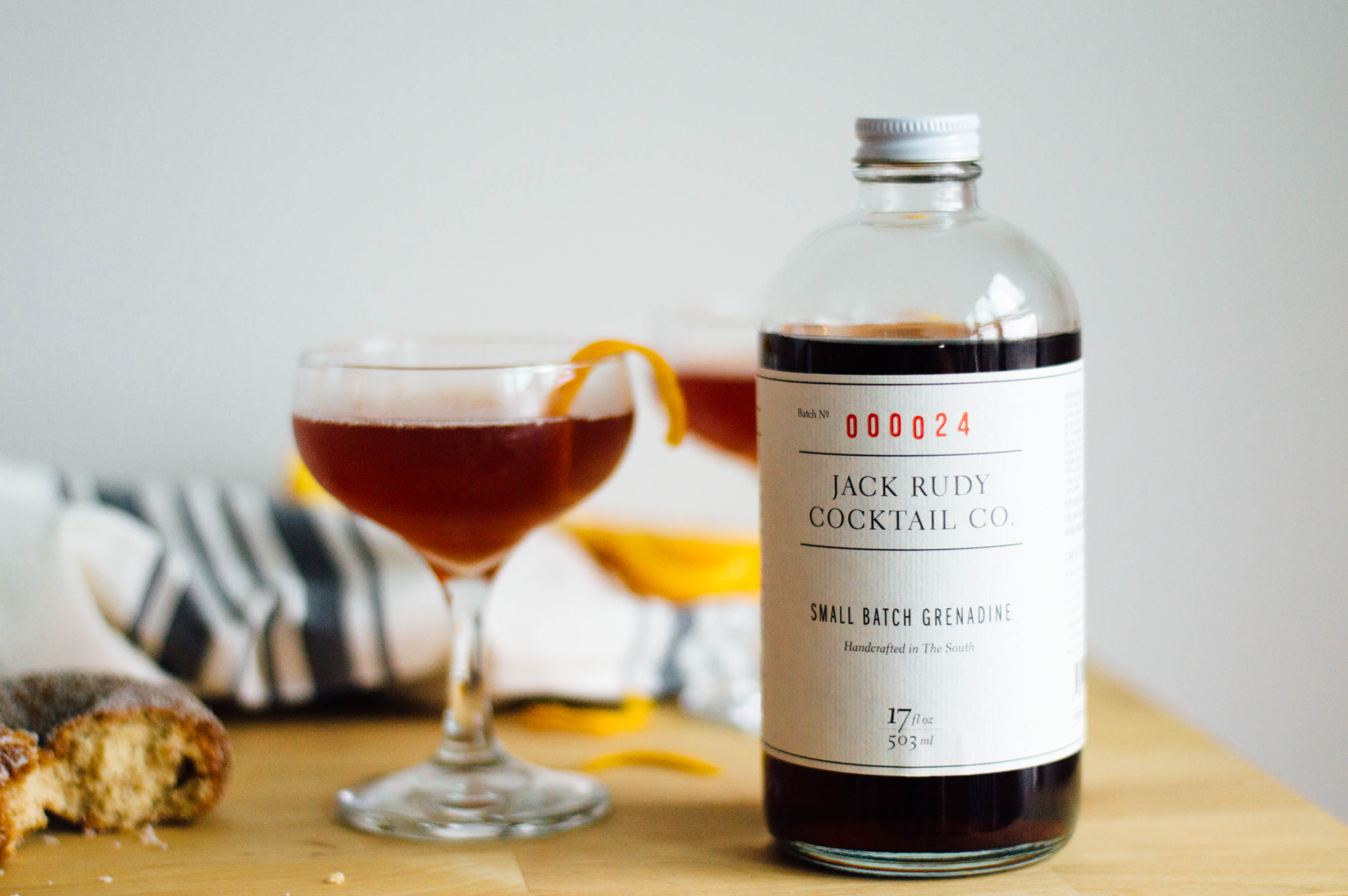 The Jack Rose Cocktail recipe - perfect for serving in a coupe glass during happy hour! | bygabriella.co