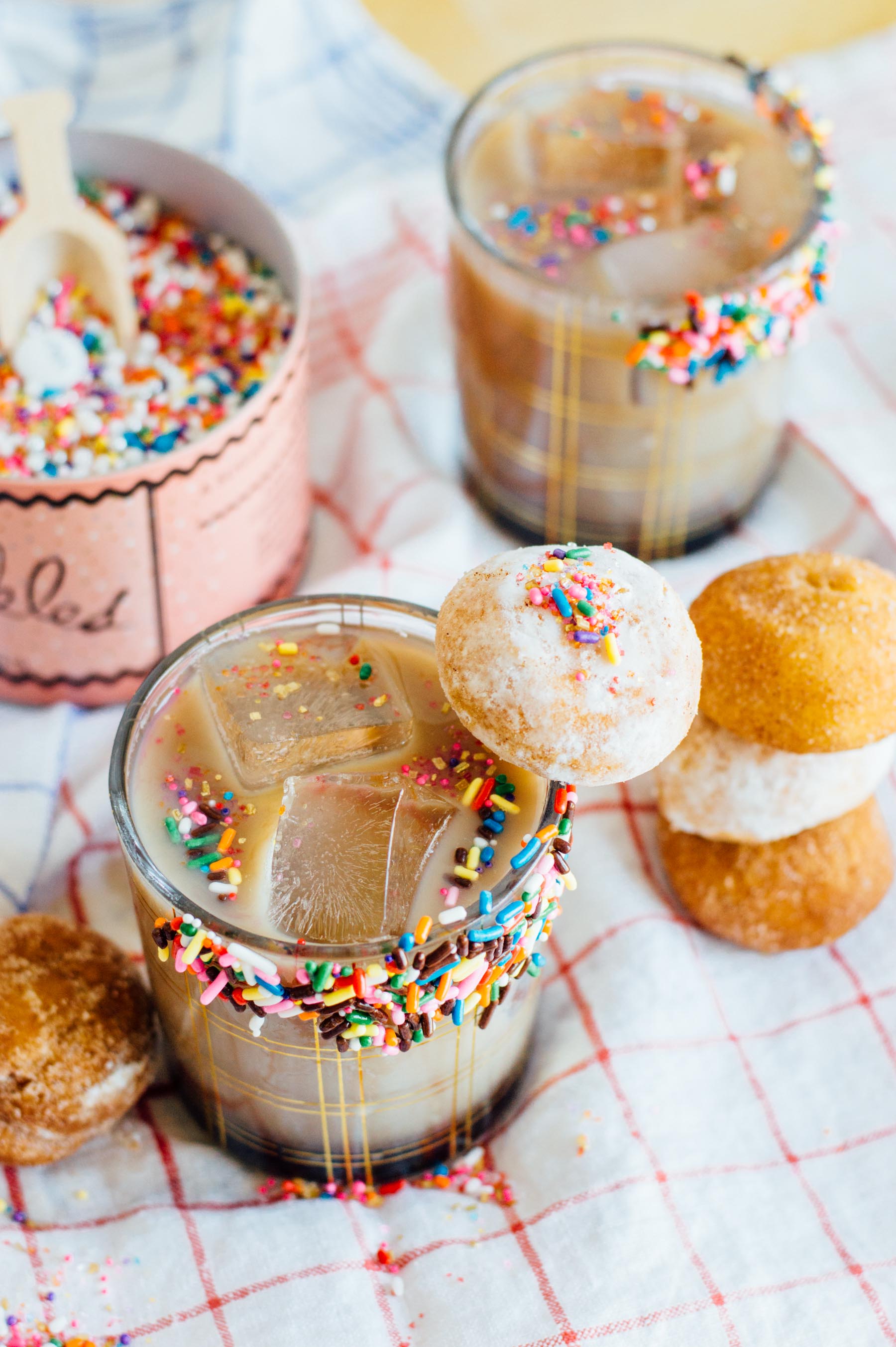 A tasty Coffee Milk Punch with a glazed sprinkles doughnut rim | bygabriella.co
