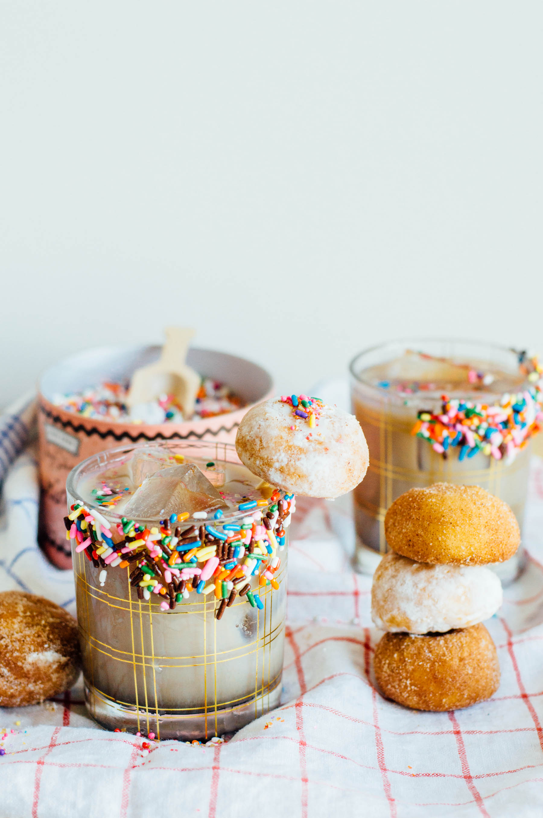 A tasty Coffee Milk Punch with a glazed sprinkles doughnut rim | bygabriella.co