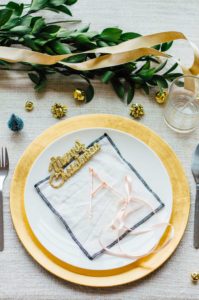 An easy holiday place card DIY project featuring copper wire, ribbon, and fresh greens (eucalyptus & ruscus) | bygabriella.co