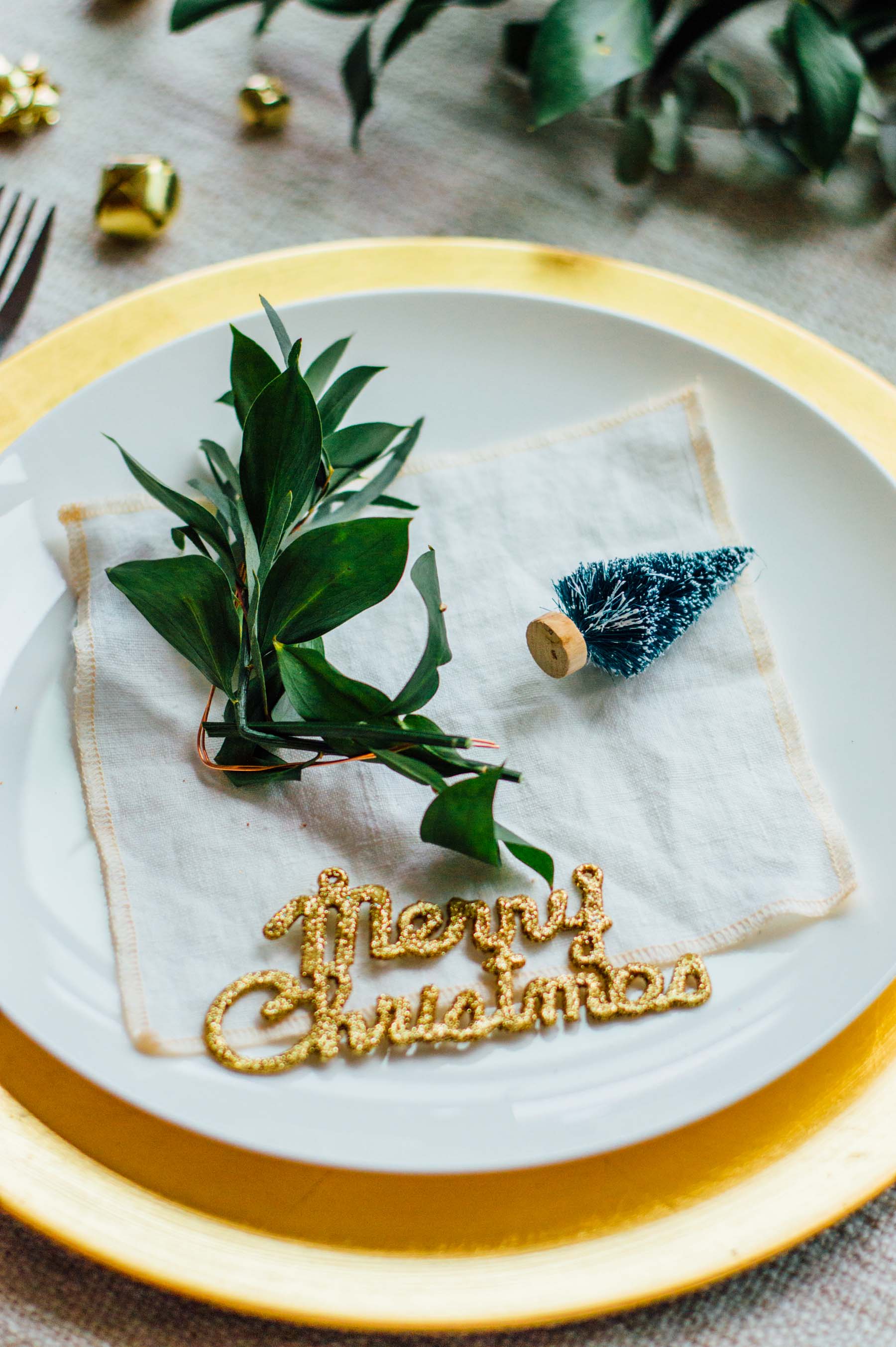 An easy holiday place card DIY project featuring copper wire, ribbon, and fresh greens (eucalyptus & ruscus) | bygabriella.co