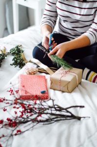 Wrap up your holiday gifts this year with fresh greenery and a few surprises! Click through to read the article with holiday gift wrapping tips | bygabriella.co
