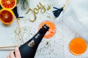 Blood Orange Cardamom Bubbly recipe featuring blood oranges, a vanilla-cardamom syrup, and cava. | bygabriella.co