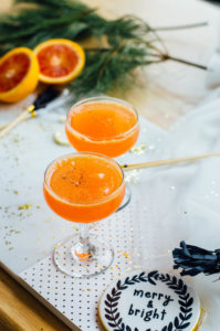 A Blood Orange Cardamom Bubbly cocktail recipe just in time for New Year's Eve! Blood Orange Cardamom Bubbly recipe featuring blood oranges, a vanilla-cardamom syrup, and cava. | bygabriella.co It's here! Happy almost 2017, friends! New Year's Eve is one of my favorite days of the year - the glitter, the celebrations, the cocktails (duh), and time spent with friends all in one day. Count me a NYE fan for life. <div class="ezcol ezcol-one-half">Blood Orange Cardamom Bubbly recipe featuring blood oranges, a vanilla-cardamom syrup, and cava. | bygabriella.co</div> <div class="ezcol ezcol-one-half ezcol-last">Blood Orange Cardamom Bubbly recipe featuring blood oranges, a vanilla-cardamom syrup, and cava. | bygabriella.co</div><div class="ezcol-divider"></div> Blood Orange Cardamom Bubbly With New Year's Eve's rapid arrival (I mean really, how is it here already?), I wanted to create an easy to make cocktail with just a few ingredients. However, I always love adding something a little special. A fun homemade surprise, if you will. For this Blood Orange Cardamom Bubbly, it's the tasty vanilla-cardamom simple syrup. If you're new to making simple syrup at home, this one is no different. All you add is a touch of vanilla extract and a hint of cardamom. <div class="ezcol ezcol-one-third">Ingredients For the cocktail 3 parts freshly squeezed blood orange juice 2 parts cava 1 part vanilla-cardamom simple syrup For the vanilla-cardamom simple syrup 1 part granulated sugar 1 part water Sprinkle of cardamom 1 teaspoon vanilla extract</div> <div class="ezcol ezcol-two-third ezcol-last">Directions 1. Make your simple syrup. Heat water and sugar over low heat until combined. 2. Take off heat and add vanilla and cardamom. 3. Stir and let sit for 15 minutes. 4. Mix blood orange juice and vanilla-cardamom syrup in glass. 5. Add cava and stir once.</div><div class="ezcol-divider"></div> Blood Orange Cardamom Bubbly recipe featuring blood oranges, a vanilla-cardamom syrup, and cava. | bygabriella.co How are you celebrating New Year's Eve this evening? We're heading to a little get-together with a few friends to ring in the new year. No matter what you end up doing, I hope it's a sparkly, festive, happy occasion! Here's to 2017, y'all! g.