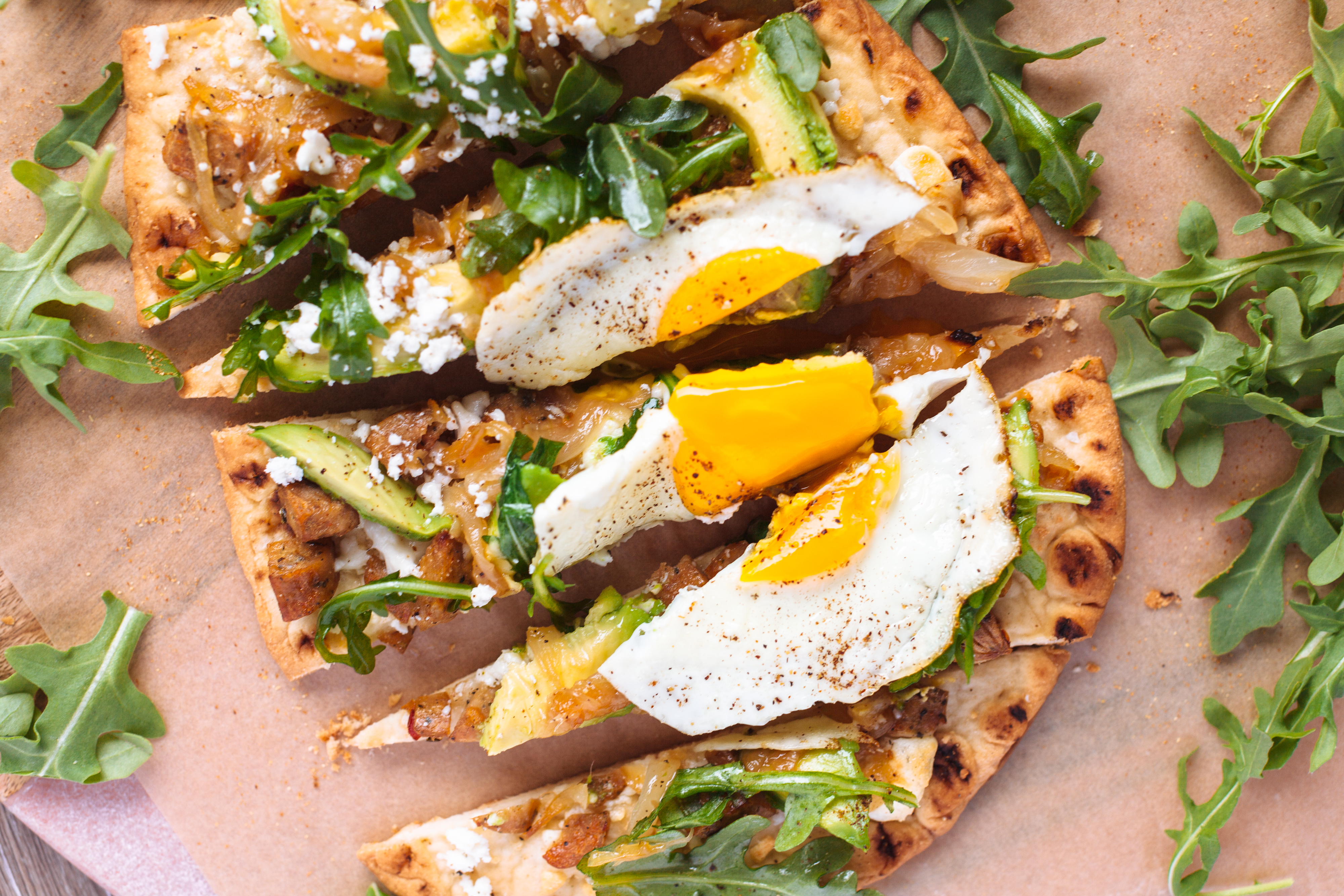 Breakfast naan pizza recipe with caramelized onions, jalapeño sausage, and queso fresco - so much yum! | bygabriella.co