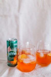 A Grapefruit Aperol Spritz made with Perrier's tasty carbonated water | bygabriella.co