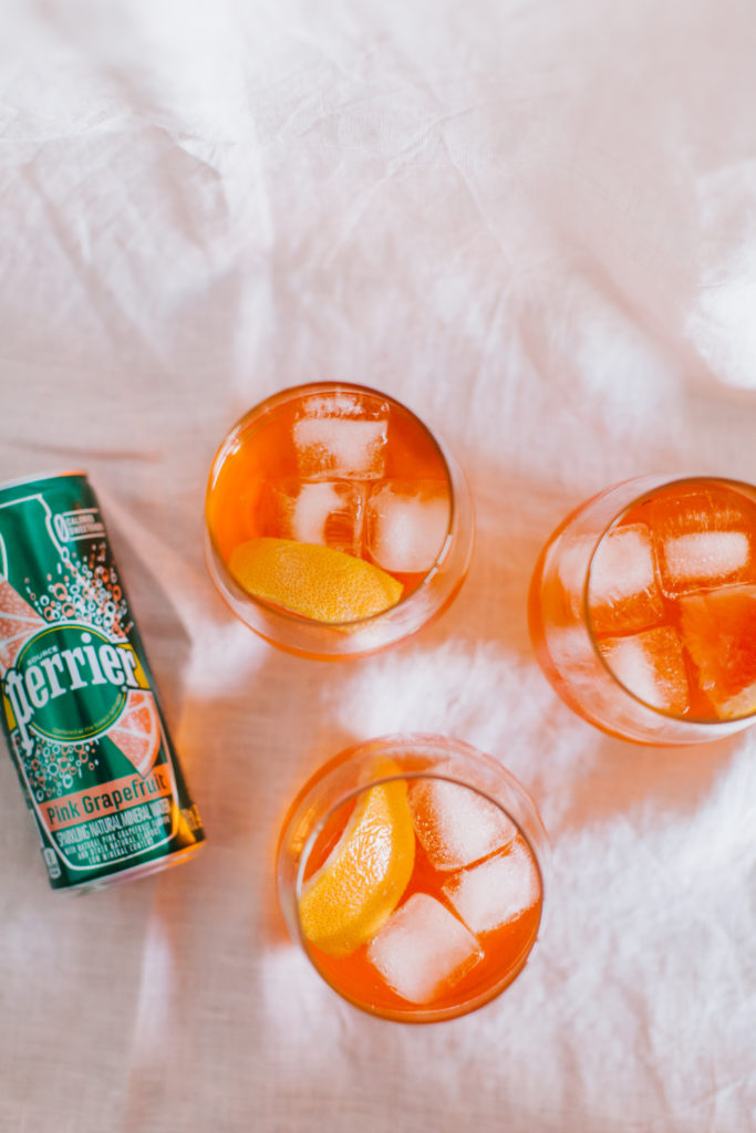 A Grapefruit Aperol Spritz made with Perrier's tasty carbonated water | bygabriella.co