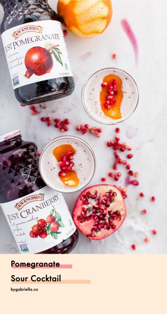 Pomegranate Sour Cocktail with Spiced Orange Syrup - so perfect for fall and winter. A fruity holiday cocktail that's sure to please your guests | bygabriella.co @gabivalladares