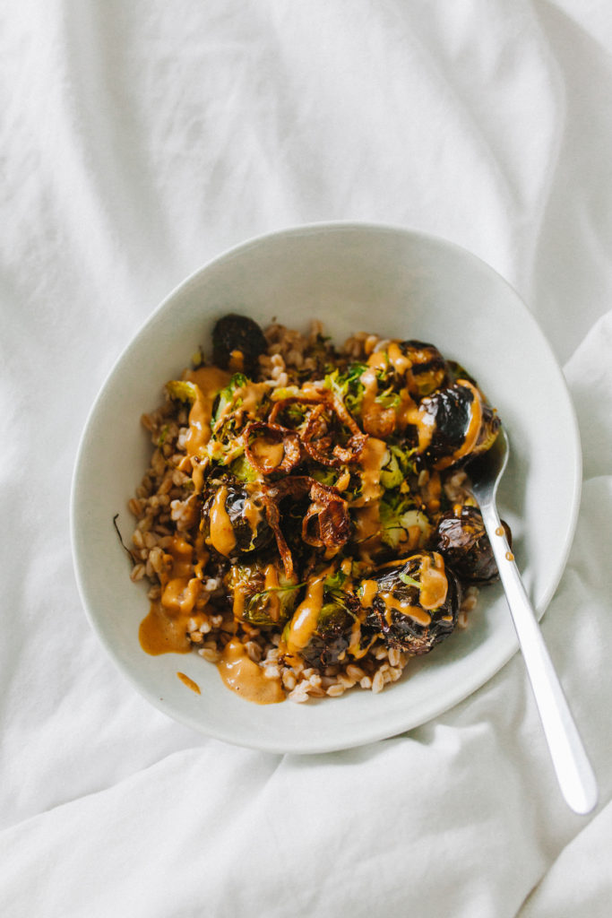 One of our favorite trader joe's recipes - an easy farro bowl with roasted brussels sprouts and thai peanut sauce | bygabriella.co @gabivalladares