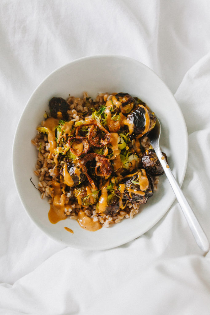 One of our favorite trader joe's recipes - an easy farro bowl with roasted brussels sprouts and thai peanut sauce | bygabriella.co @gabivalladares