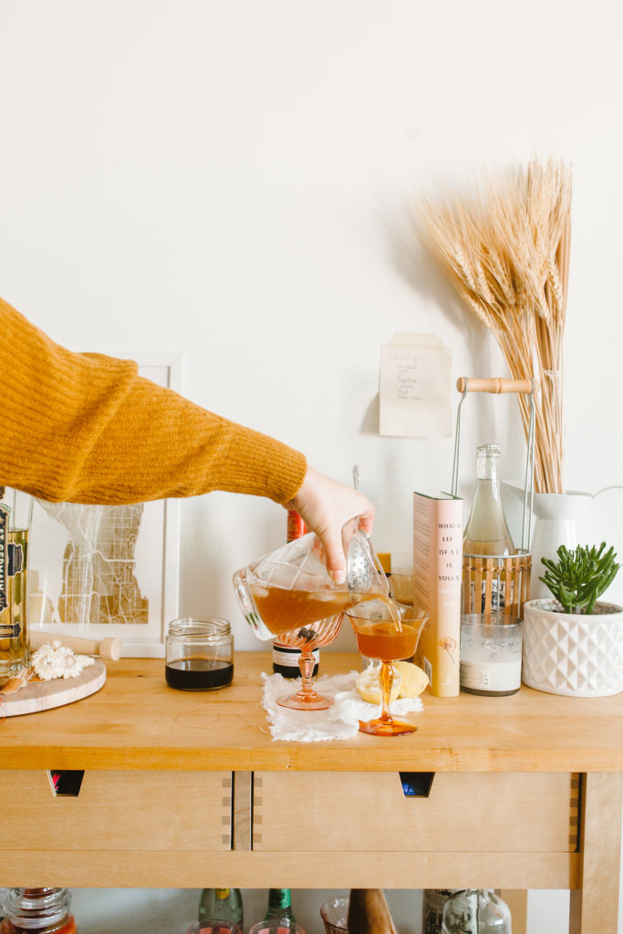 A delicious apple cider cocktail - meet the apple cider manhattan, a fall spiced easy cocktail to whip up right at home! Inspired by the book What's Left Of Me Is Yours | bygabriella.co