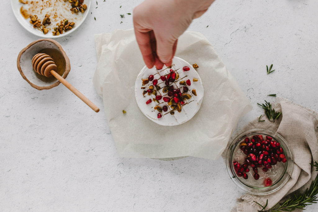 An easy baked brie recipe for the holidays featuring brown butter pistachios | bygabriella.co